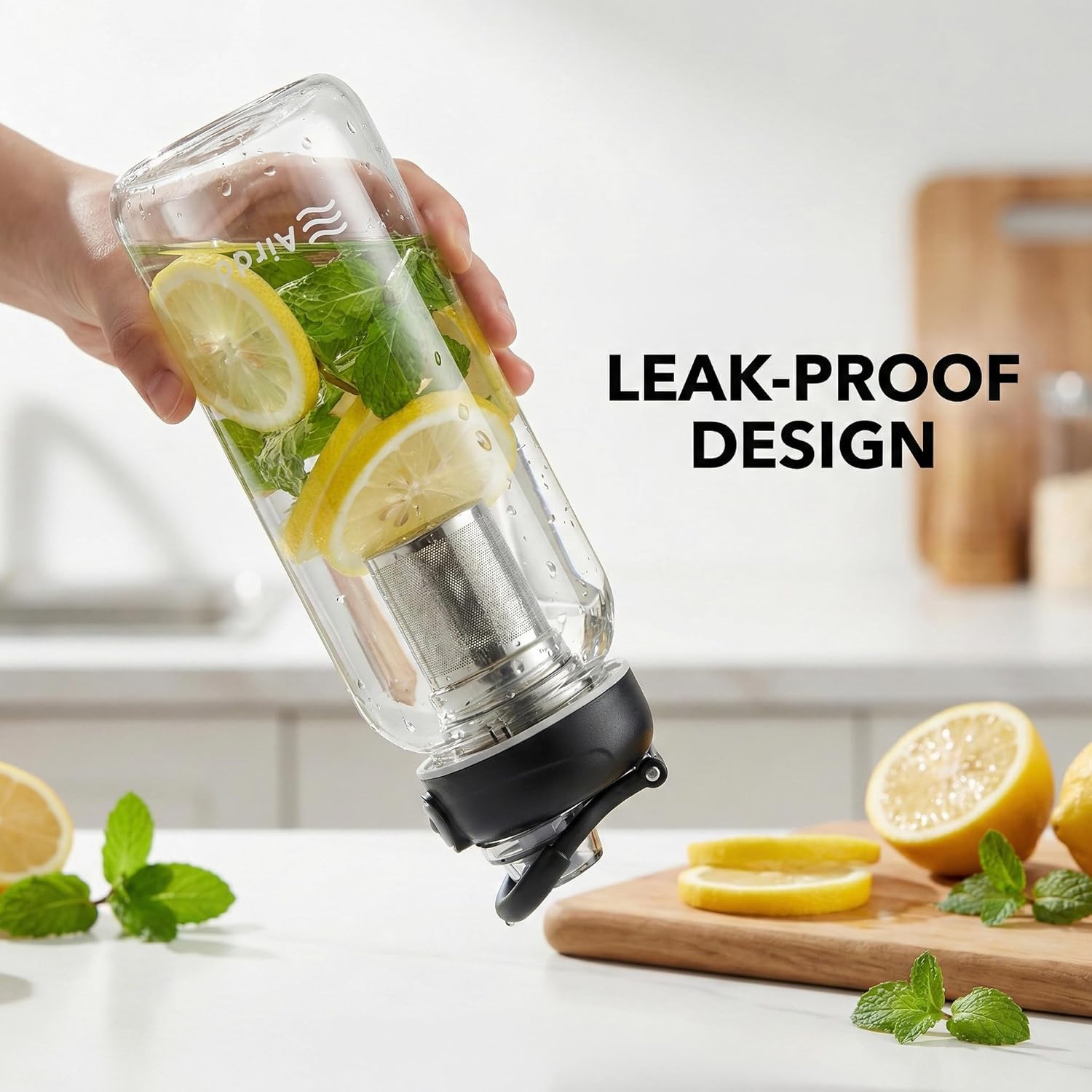 Leak-proof design — bottle held upside down with lemon and mint infusion